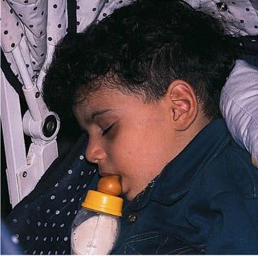 child-sleeping-with-bottle